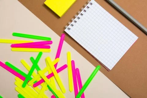 Blank notebook and a bunch of colored counting sticks Stock Photos