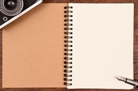Blank notebook and pen with camera Stock Photos