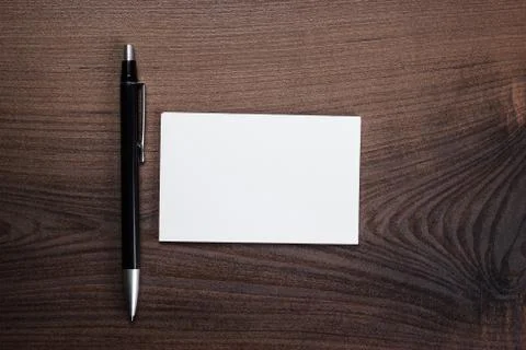 Blank notebook and pen on the table Stock Photos