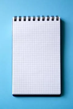 Blank notebook on a blue background. Stock Photos