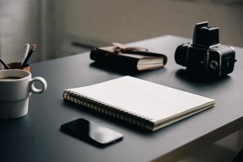 Blank notebook on creative workspace Stock Photos