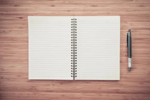 Blank notebook on desk background. Stock Photos