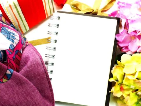Blank notebook diary with gift and flower background Stock Photos