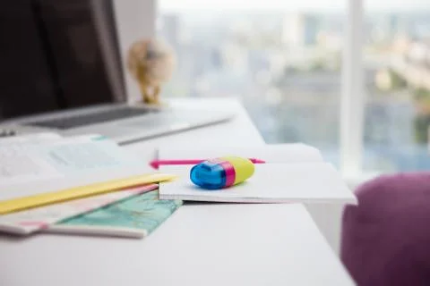Blank notebook, eraser, pencil, sharpener on table Stock Photos