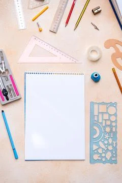 Blank notebook with geometry drafting tools background. Various stationery fo Stock Photos