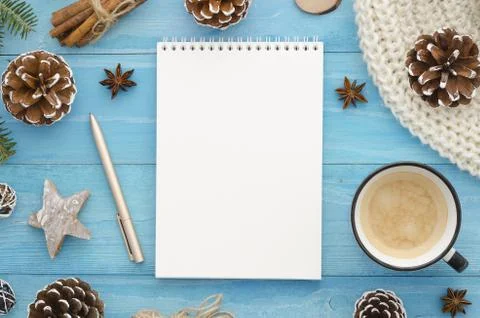 Blank notebook mock-up. Rustic blue wooden planks with anise star, pine cones Stock Photos