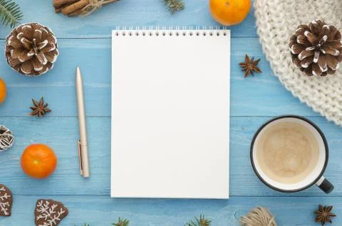 Blank notebook mock-up. Rustic blue wooden planks with anise star, pine cones Stock Photos