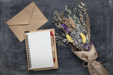 Blank notebook mockup with white pages, envelope and spring bouquet of dried  Stock Photos