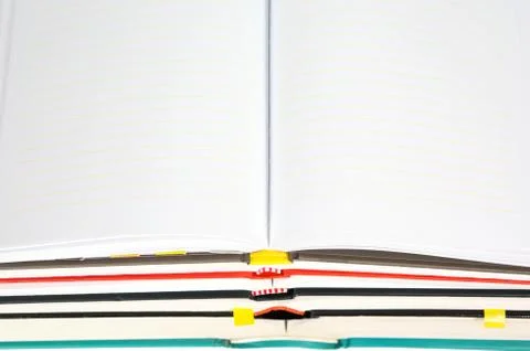 Blank notebook open on stack of book Stock Photos