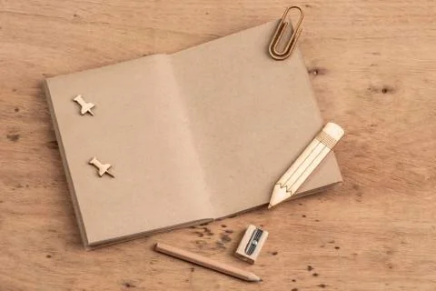 Blank notebook opened on a wooden table with copy space Stock Photos