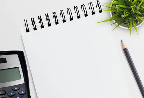 Blank notebook or notepad on white office desk background. Stock Photos