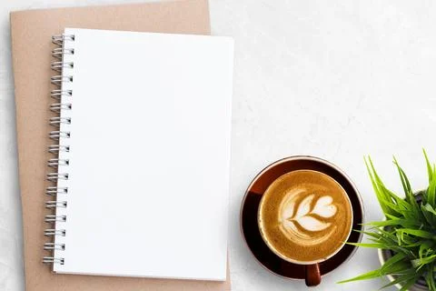 Blank notebook or notepad on white office desk background. Stock Photos