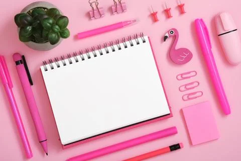 Blank notebook page for text in frame of pink stationery set on pink back Stock Photos