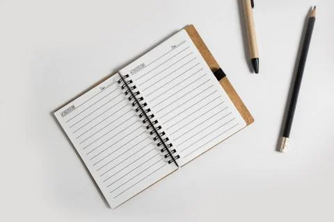 Blank notebook with pen and pencil Stock Photos