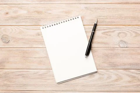Blank notebook with pen on white background. Back to school and education con Stock Photos