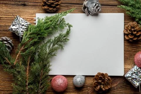 Blank notebook sheet for copy space with fir, spruce branches and Christmas t Stock Photos