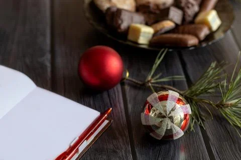 Blank notebook sheet for plan for new year in cozy setting. Christmas decor,  Stock Photos