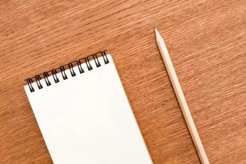 Blank notebook with spiral for the application of labels and pen on wooden ba Stock Photos
