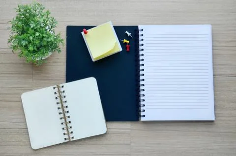 Blank notebook on the wood table - top view Stock Photos