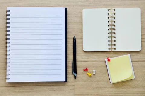 Blank notebook on the wood table - top view Stock Photos