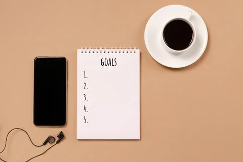 Blank notepad for action plans goals coffee cup phone pastel background Stock Photos