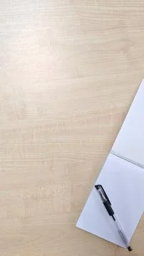 Blank Notepad and Pen on Light Wood Desk Surface Stock Photos