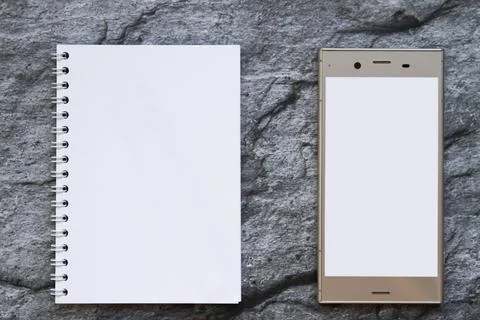Blank notepad and smartphone Stock Photos