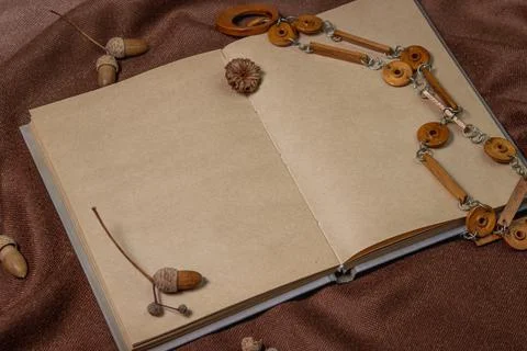 Blank notepad on brown background. Background for an inscription or logo.  Stock Photos