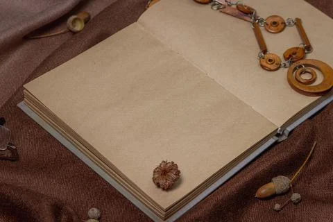 Blank notepad on brown background. Background for an inscription or logo.  Stock Photos