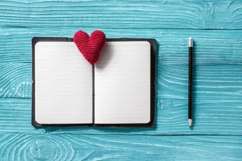 Blank notepad for copy space and vintage handmaded valentines day toy heart o Stock Photos