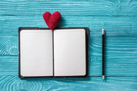 Blank notepad for copy space and vintage handmaded valentines day toy heart o Stock Photos