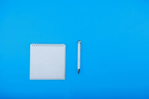 Blank notepad with copy space for your text and white pen top view Stock Photos