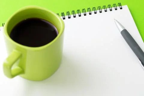 Blank notepad with a cup of coffee and pen Stock Photos