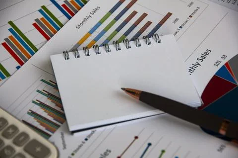 Blank notepad with customizable space for text with graph analysis background Stock Photos