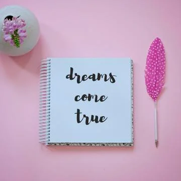 Blank notepad, flowers and feather pen as mockup for your design. Pink Stock Photos
