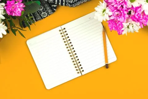 Blank notepad mockup, spring background and office workspace composition, flo Stock Photos