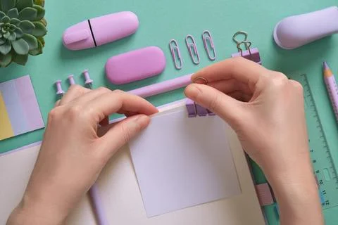 Blank notepad page for your text in pastel colored stationery frame. A woman  Stock Photos