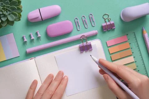 Blank notepad page for your text in pastel colored stationery frame. A woman  Stock Photos