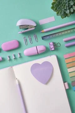 Blank notepad page for your text with purple school and office stationery on  Stock Photos