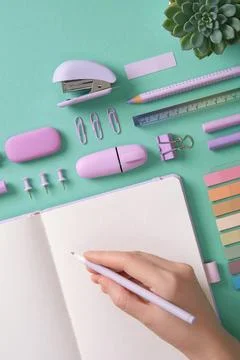 Blank notepad page for your text in pastel colored stationery frame. A woman  Stock Photos