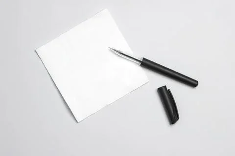 Blank notepad with pen on gray background for writing Foto stock