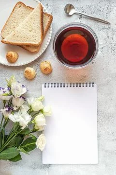 A blank notepad sheet with breakfast setting and flowers Stock Photos