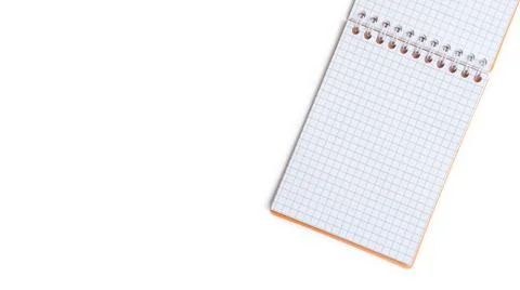 Blank notepad with wire binding on a white background. Top view with copy space. Stock Photos