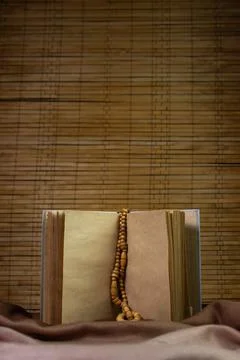 Blank notepad on a wooden background. Old paper notebook.  Stock Photos