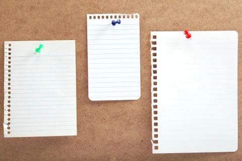 Blank notes with buttons on a wooden board. Stock Photos