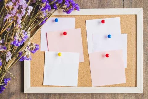 Blank notes on the cork board with dry flower bouquet,wooden background Stock Photos