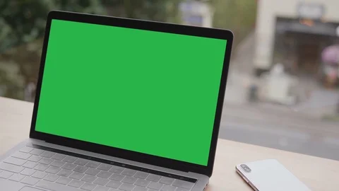 Blank Office Laptop Computer Screen and Wood Table Window View and Modern Mobile Stock Footage 99667802
