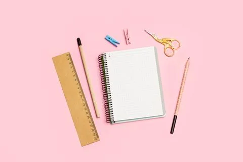 Blank open graph paper notebook, two pencils, a ruler and a stork scissors Stock Photos