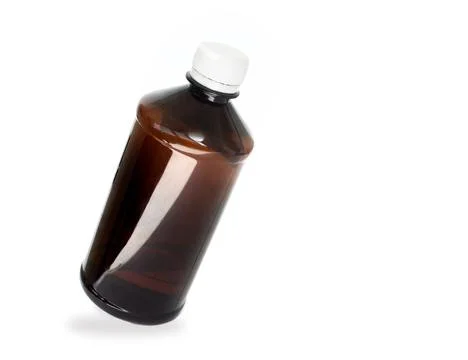 Blank packaging brown transparent plastic bottle with white cap isolated on Stock Photos
