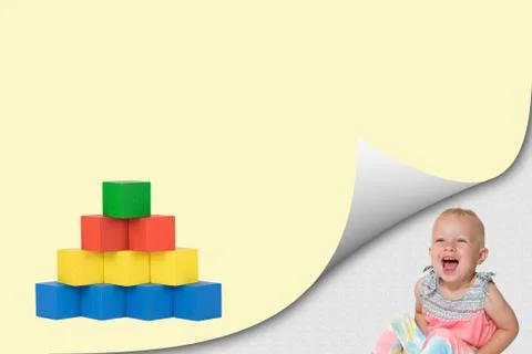Blank page with curl effect and pyramid and laughing toddler girl Stock Photos